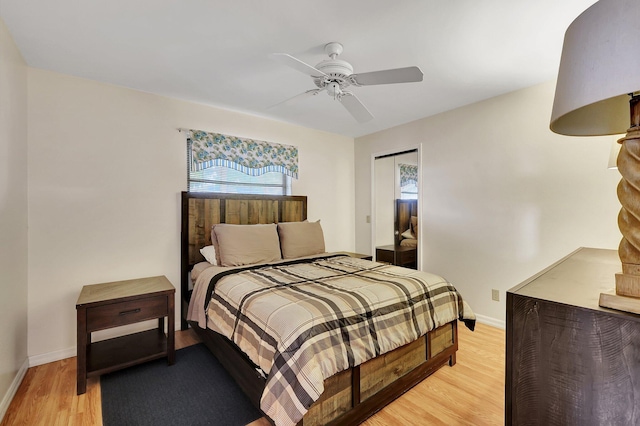 bedroom with ceiling fan and light hardwood / wood-style floors