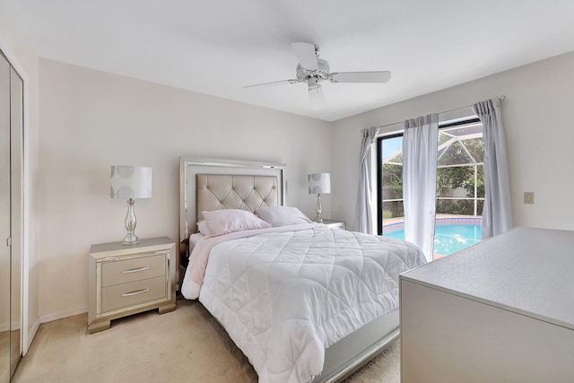 carpeted bedroom with ceiling fan and a closet