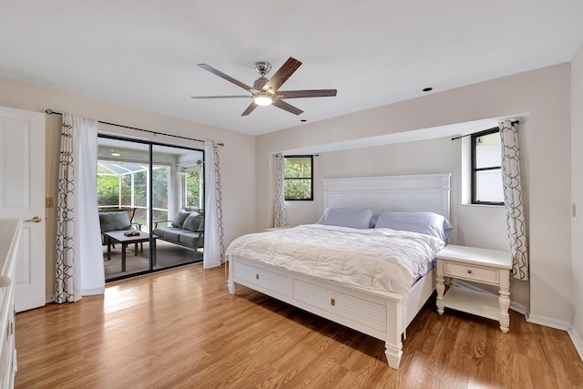 bedroom with access to outside, light hardwood / wood-style flooring, and ceiling fan