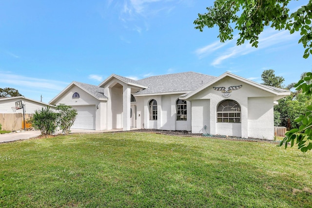 view of front facade with a front lawn and a garage