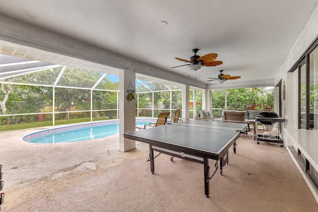 interior space with ceiling fan