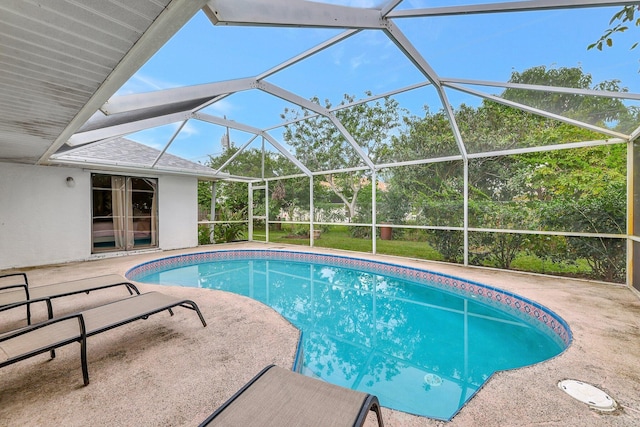 view of pool with a lanai and a patio area