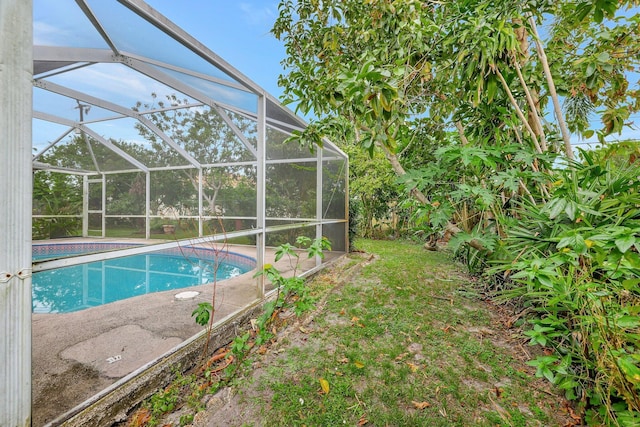 view of pool featuring a lanai