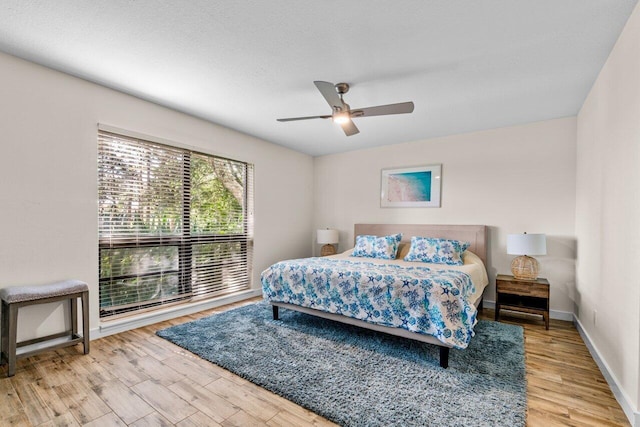 bedroom featuring ceiling fan and hardwood / wood-style flooring