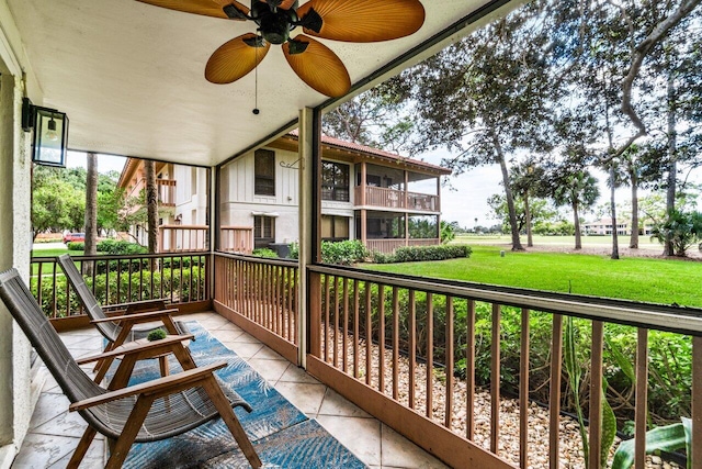 balcony with a porch and ceiling fan