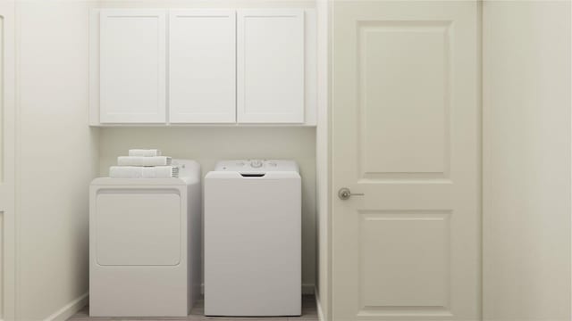 laundry area featuring cabinets and independent washer and dryer