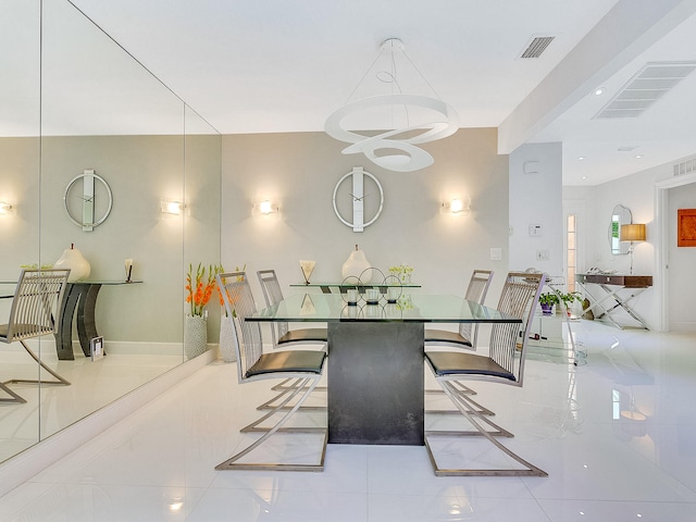 dining space featuring light tile patterned floors