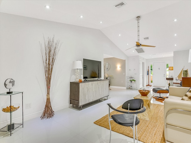 living room featuring light tile patterned floors, ceiling fan, and lofted ceiling