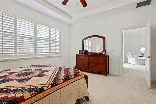 bedroom featuring ceiling fan and light carpet