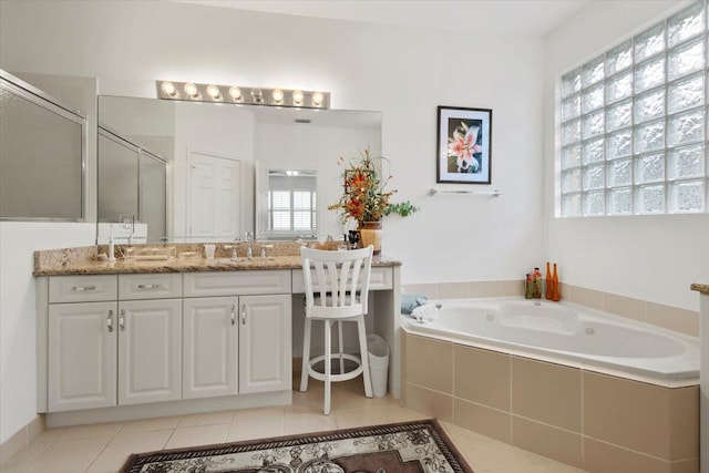 bathroom featuring tile patterned floors, vanity, and plus walk in shower