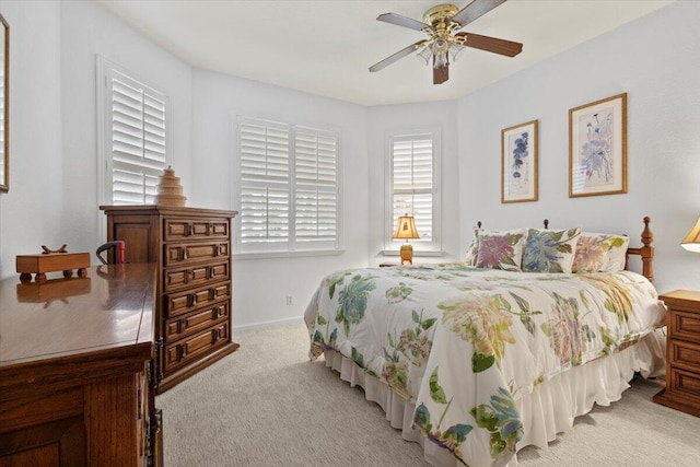 bedroom featuring ceiling fan and light colored carpet