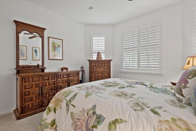 bedroom featuring light colored carpet