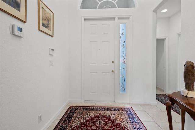 entrance foyer with light tile patterned floors