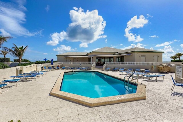 view of swimming pool with a patio area