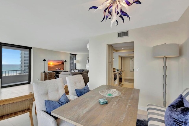 dining area featuring a water view