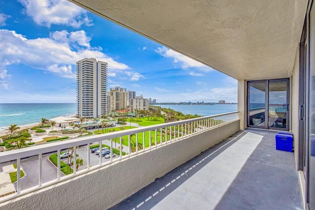 balcony featuring a water view