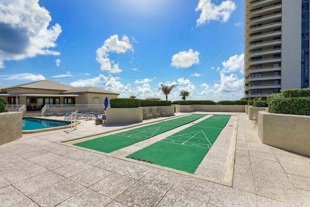 view of home's community featuring a patio area and a swimming pool