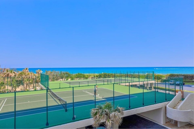 view of sport court featuring a water view