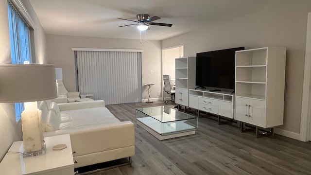 living room with hardwood / wood-style floors and ceiling fan