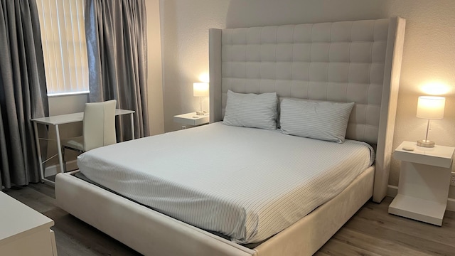 bedroom featuring hardwood / wood-style floors