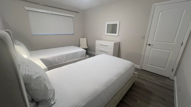 bedroom featuring dark hardwood / wood-style flooring