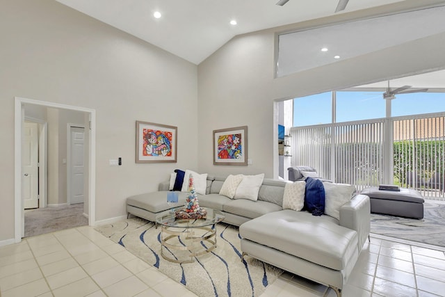 living room with ceiling fan, light tile patterned floors, and high vaulted ceiling