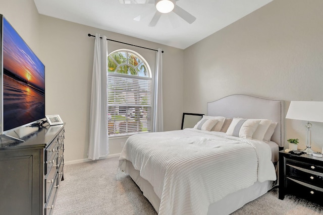 bedroom featuring ceiling fan and light carpet