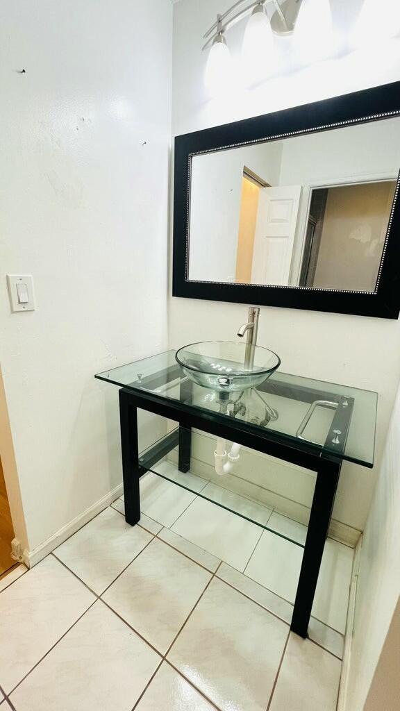 bathroom featuring tile patterned floors and sink