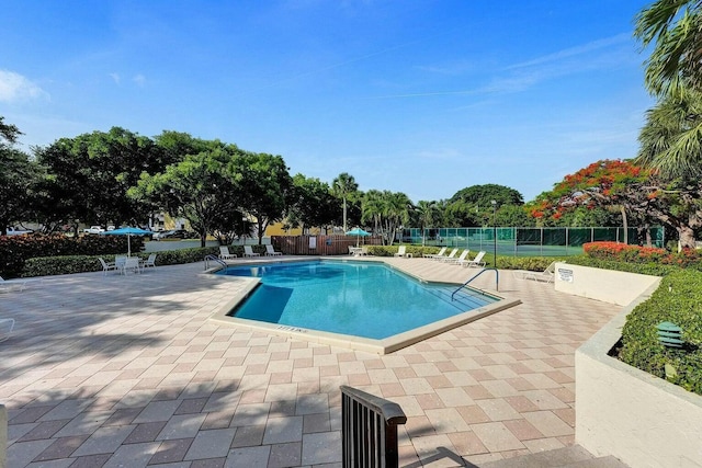 view of swimming pool with a patio