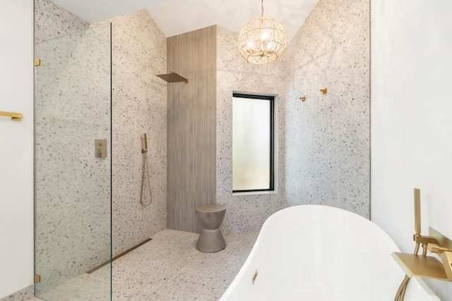 bathroom with separate shower and tub and a notable chandelier