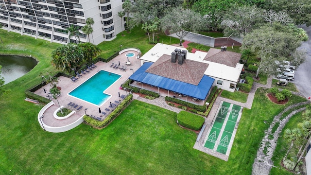 birds eye view of property with a water view