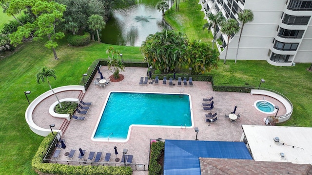 view of pool with central AC unit and a patio area