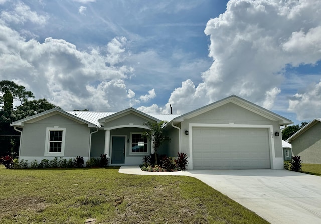 single story home featuring a garage and a front lawn