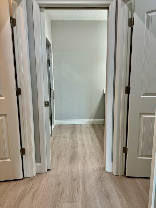 hallway featuring light hardwood / wood-style flooring