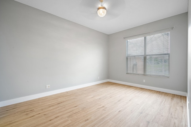 spare room featuring ceiling fan and light hardwood / wood-style flooring