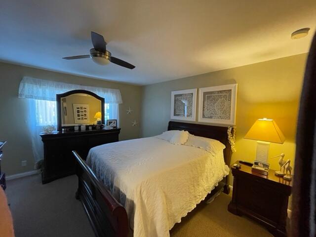 bedroom featuring carpet floors and ceiling fan