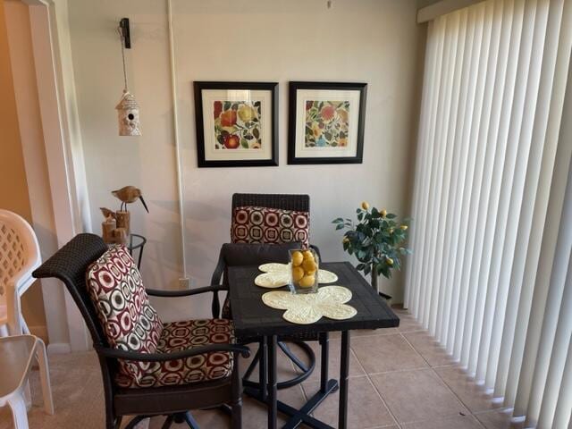 dining area with light tile patterned flooring