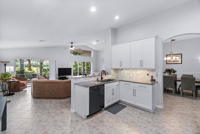 kitchen featuring ceiling fan with notable chandelier, sink, stone counters, black dishwasher, and white cabinetry