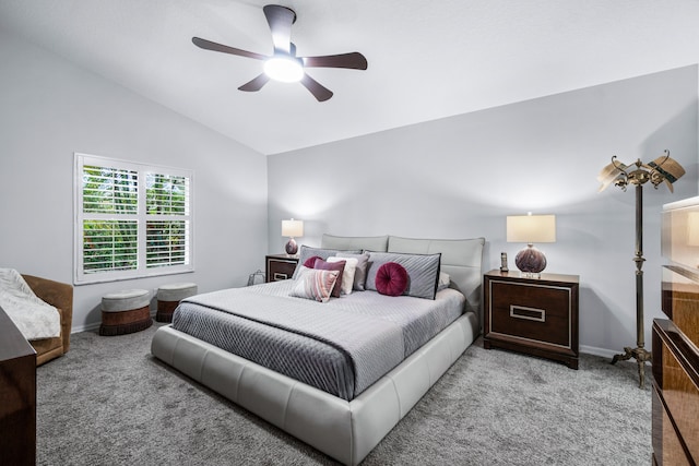 carpeted bedroom featuring vaulted ceiling and ceiling fan