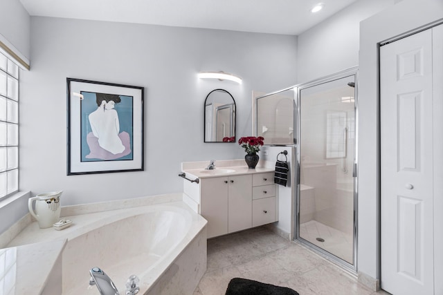 bathroom with tile patterned flooring, vanity, and independent shower and bath