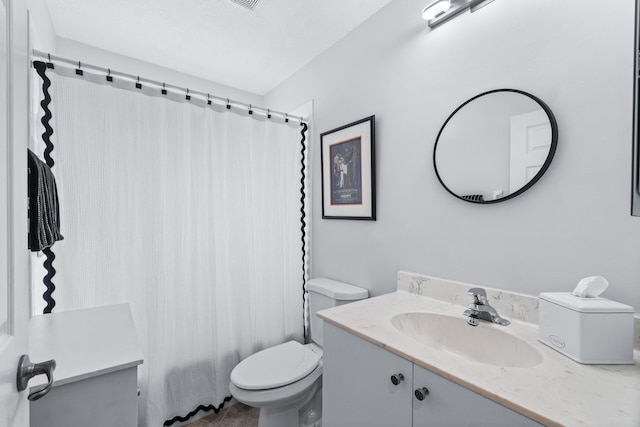 full bathroom with shower / bath combo with shower curtain, vanity, and toilet