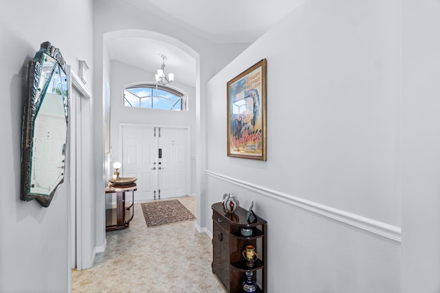 entryway featuring a chandelier