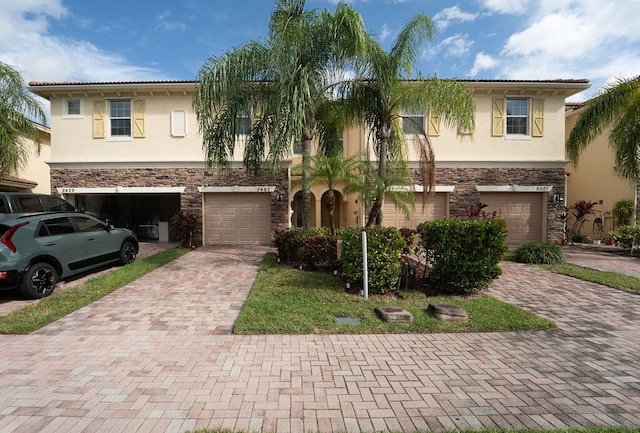 mediterranean / spanish-style home with a garage