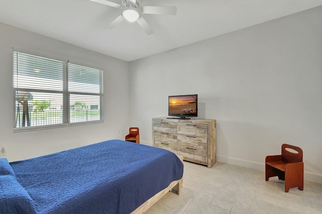 bedroom featuring light tile patterned floors and ceiling fan