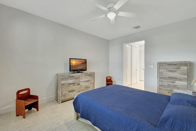 bedroom with ceiling fan and light tile patterned flooring