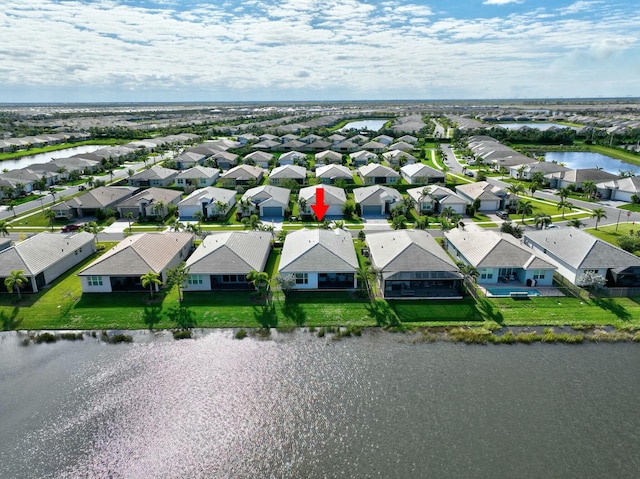 birds eye view of property featuring a water view