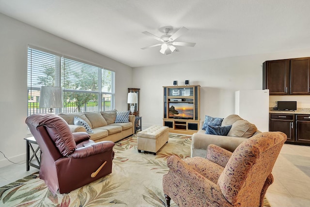 tiled living room featuring ceiling fan