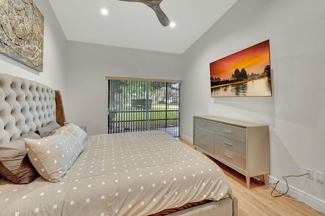 bedroom with ceiling fan, light hardwood / wood-style floors, access to exterior, and vaulted ceiling