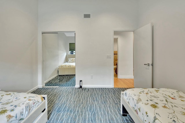 carpeted bedroom with a closet