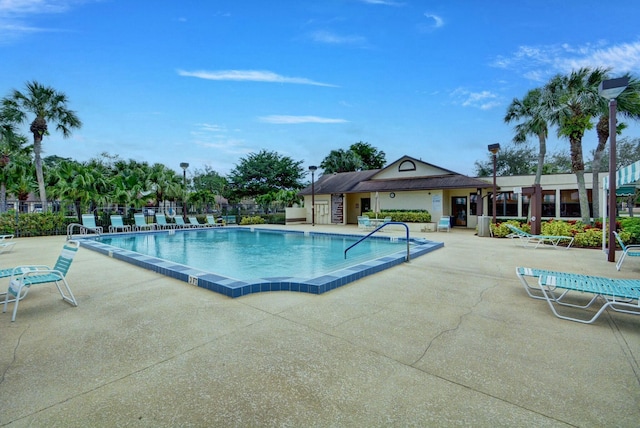 view of swimming pool with a patio